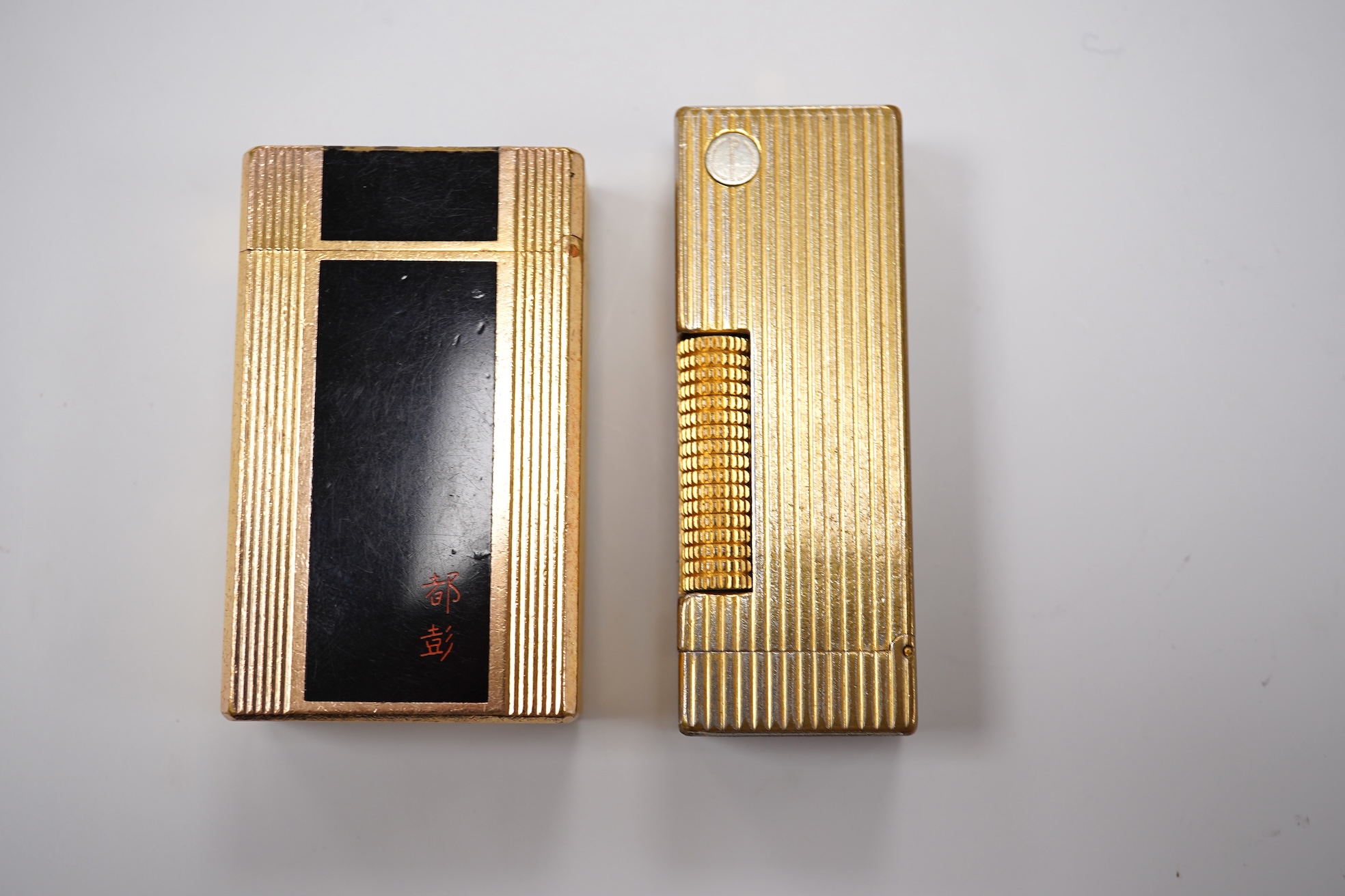 Sundry items comprising two Dupont and Dunhill lighters and cased gold and a set of cased pearl dress studs